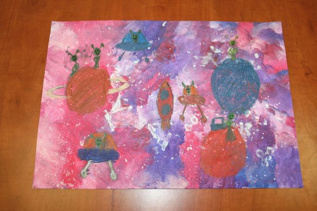 praca plastyczna przedstawiająca kosmos, rakiety i fantastyczne stworki