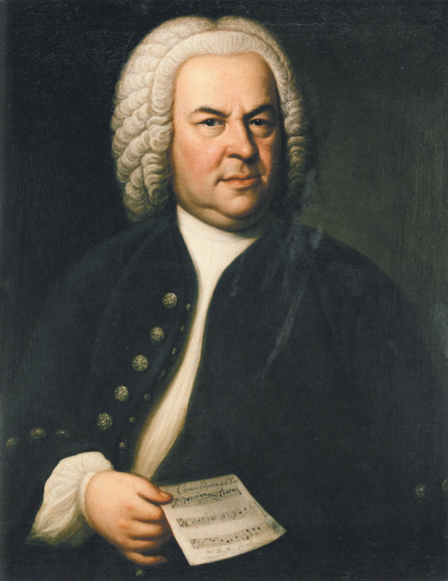 Ilustracja przedstawia Jana Sebastiana Bacha na obrazie olejnym Eliasa Gottloba Haussmanna. Bach jest ubrany w płaszcz z dużymi ozdobnymi guzikami, na głowie ma perukę, a w ręku kartkę z nutami.